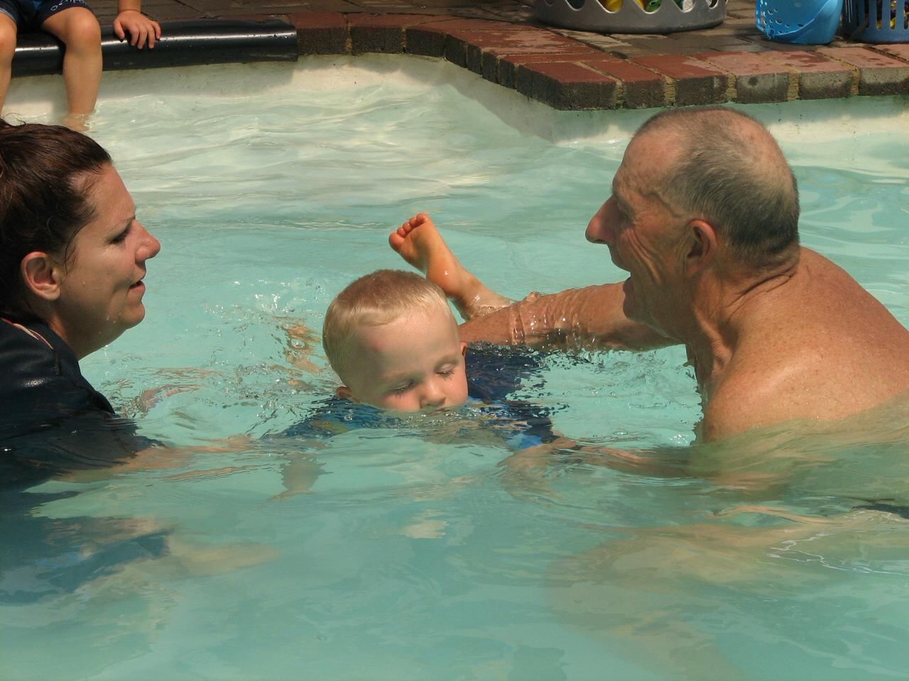 Lizette Botha and Jean Fouace exchanging notes between sessions on the pool deck during Jean's visit to Kiddies Aqua.