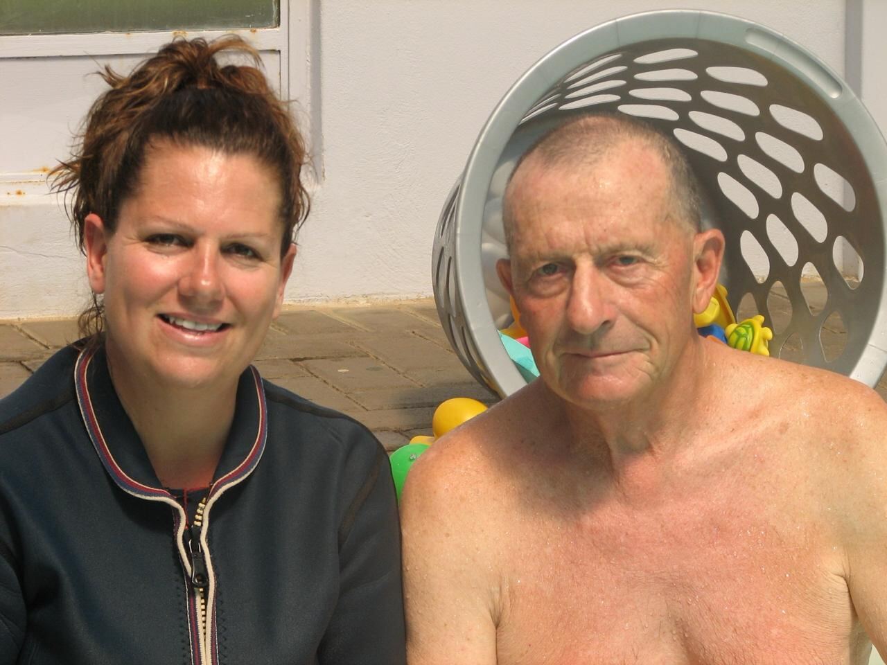 Portrait of Jean Fouace and Lizette Botha — the global pioneer of infant self-rescue and the South African coach he personally certified.