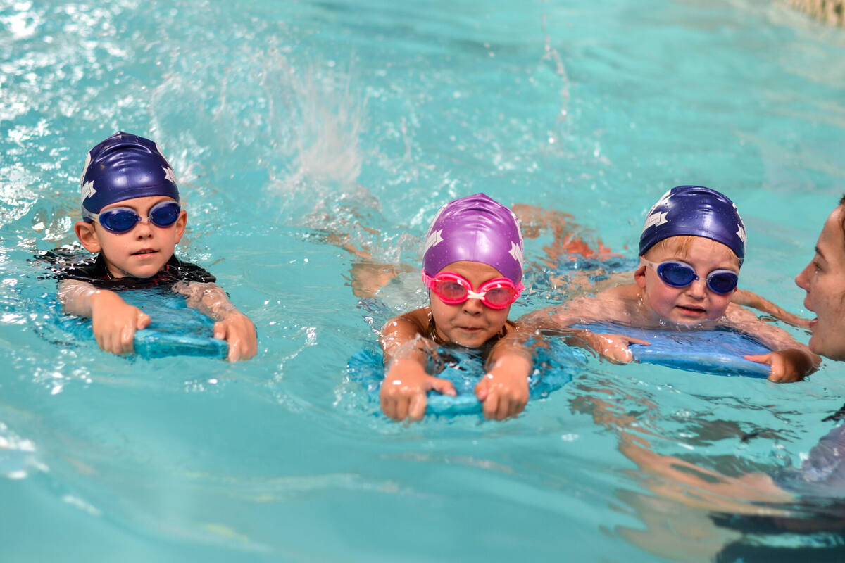 Child swimming confidently
